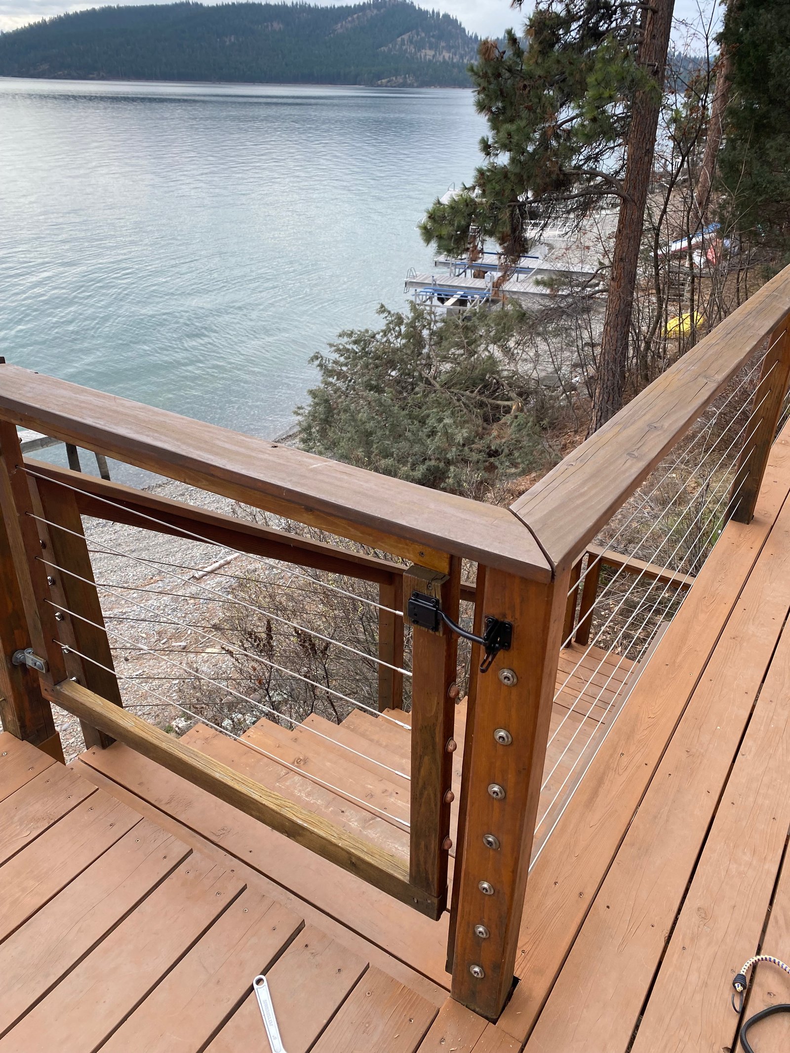 After photo of repaired deck gate latch and railing by the lake